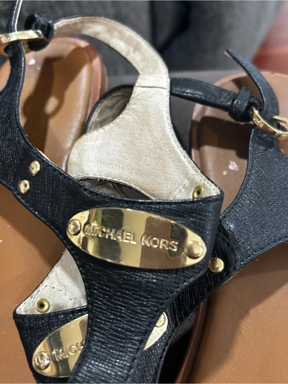 Michael Kors Black and Tan Leather T-Strap Sandals with Gold Plaques